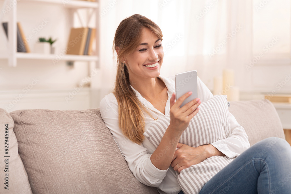 Online Chat. Positive Lady Using Smartphone Texting With Online Friends Relaxing Sitting On Couch At Home Online Chat. Positive Lady Using Smartphone Texting With Online Friends Relaxing Sitting On Couch At Home