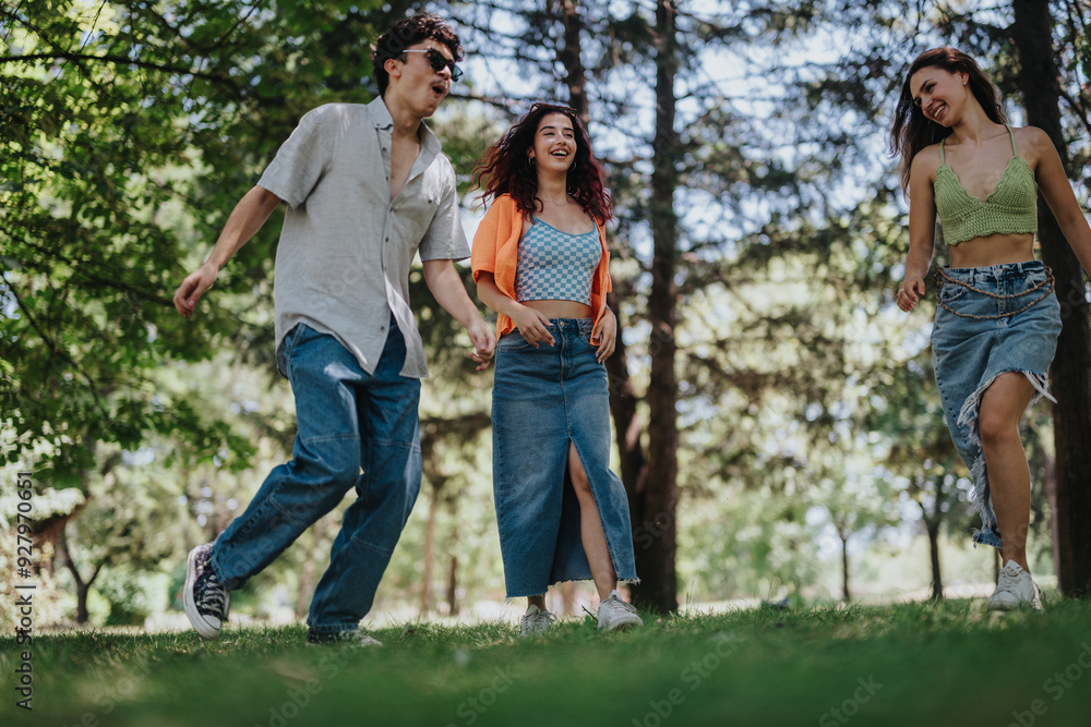 A group of young teenagers having fun in the park, showcasing friendship, joy, moments of laughter, and happiness. A group of young teenagers having fun in the park, showcasing friendship, joy, moments of laughter, and happiness.