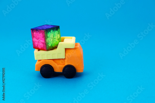 Truck transporting colorful wooden cube