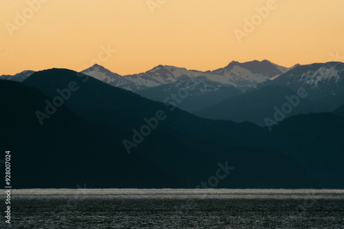 Sunset views from ferry along British Columbia coastline along the Inside Passage in summer