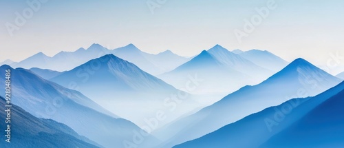 Serene blue mountain landscape with soft mist, evoking tranquility and peace in nature. Perfect for inspiring imagery or backgrounds.