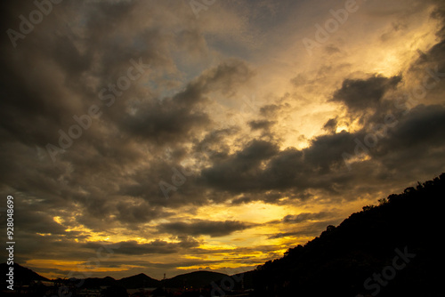 Scenic view dramatic beautiful sunset sky. Natural Sunset Sunrise on meadow silhouette shadow dark land. Vibrant dramatic sky on sunset, dawn, sunrise in Countryside. Landscape Colorful Sky At Sunset