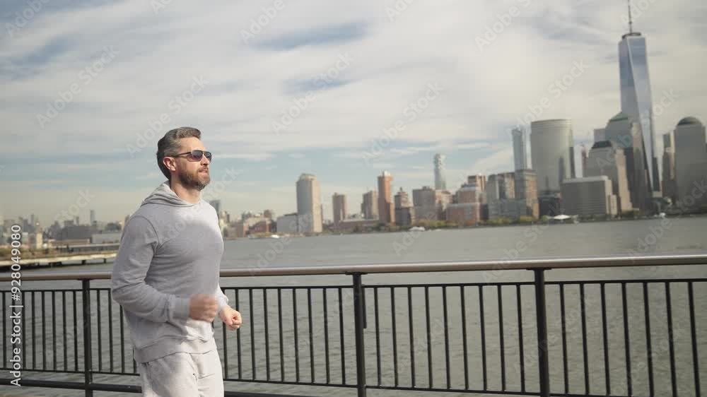 Sportsman man running outdoor. Sport running morning exercise. Man runner training in Manhattan. Sport athlete man running in New York city. Sport routine. Copy space Sportsman man running outdoor. Sport running morning exercise. Man runner training in Manhattan. Sport athlete man running in New York city. Sport routine. Copy space