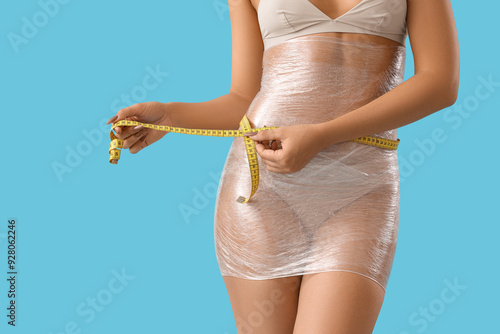 Young woman in stretch film...