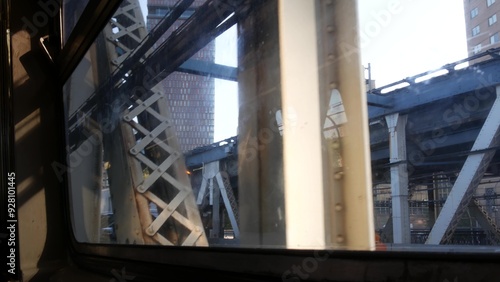 New York City subway train, Manhattan bridge. Shaking camera thru dirty window. Downtown metro transport, metropolitan traffic. Passenger elevated railway, United States. Urban life of Brooklyn.