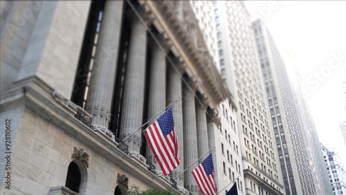 New York City, United States. Lower Manhattan Downtown Financial District urban architecture exterior. American flag. Wall street Stock Exchange building facade columns, USA Stock Market trading, NYC.