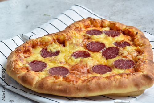 Beautiful and delicious pepperoni pizza in the shape of a heart