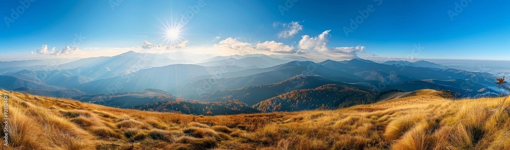 Fototapeta premium Mountaintop Panorama with Sun Rays and Golden Grass