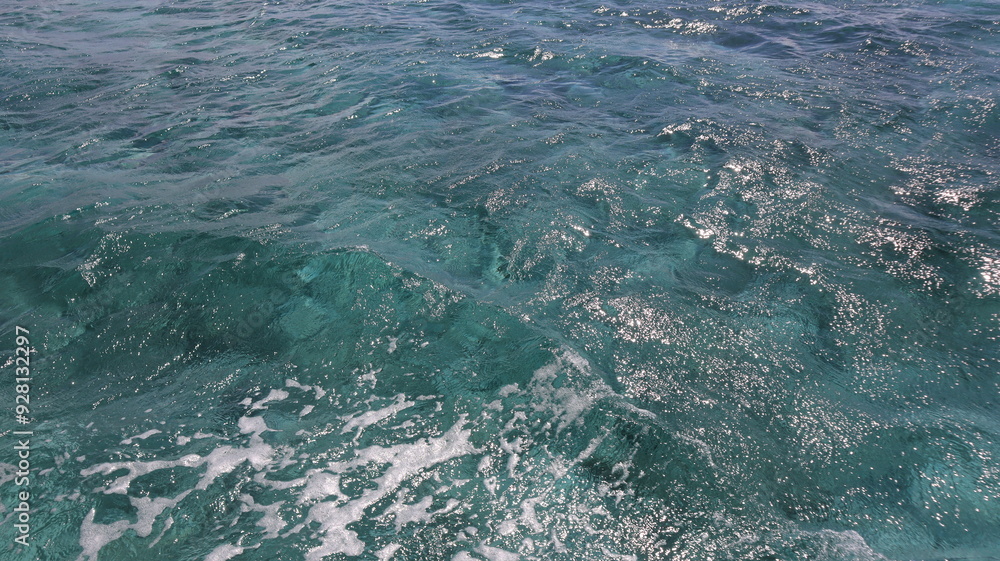 Turquoise blue green water of the sea ocean with waves that ripple across the surface of clear, turquoise water, showcasing the pristine beauty and dynamic motion of the open sea Turquoise blue green water of the sea ocean with waves that ripple across the surface of clear, turquoise water, showcasing the pristine beauty and dynamic motion of the open sea