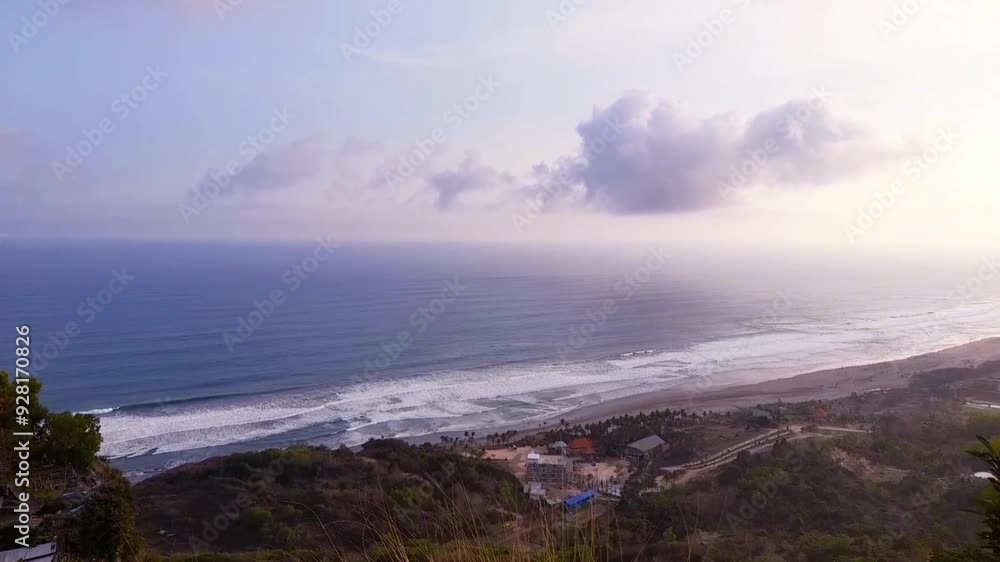 view of the South Java Sea from the top of the hill, the beach is separated from the ocean as if it were limitless, the sea is blue with waves that look calm view of the South Java Sea from the top of the hill, the beach is separated from the ocean as if it were limitless, the sea is blue with waves that look calm