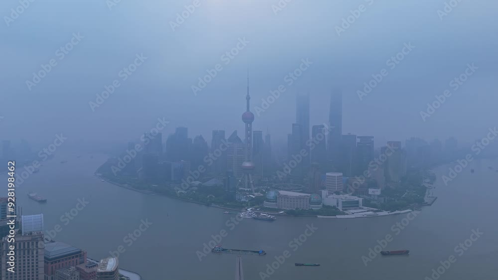 Shanghai, China - August 12th 2024: 4K real time Aerial view of modern commercial office buildings and skyline in the fog at sunrise Shanghai, China - August 12th 2024: 4K real time Aerial view of modern commercial office buildings and skyline in the fog at sunrise