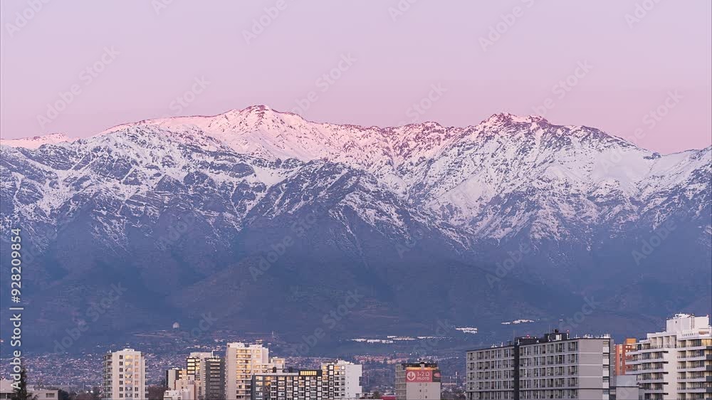 Day to night Time lapse, sunset colors in the Andes mountain range, in Santiago, Chile.