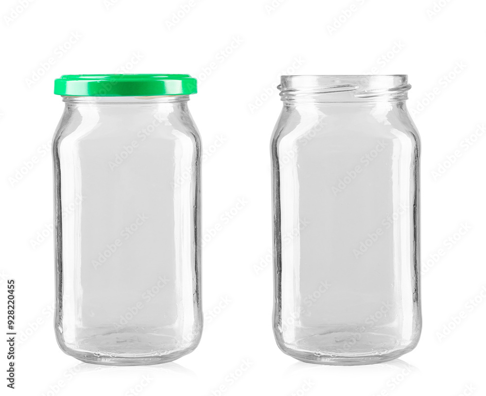 Two empty glass jars. Isolated on a white background. Two empty glass jars. Isolated on a white background.