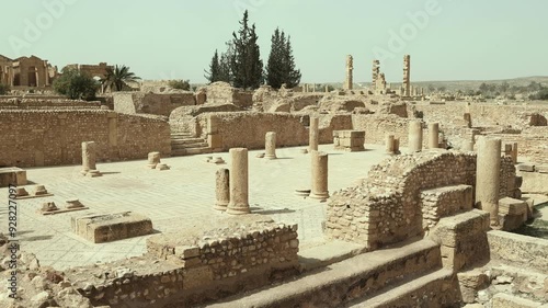 Sunlit remaining stone walls and columns of Sufetula Grand Baths standing as silent witnesses to grandeur of Roman times in Tunisia. High quality 4k footage