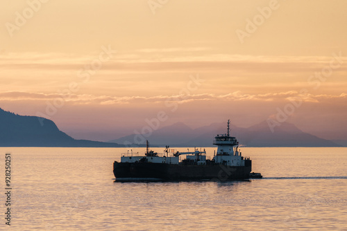 Boat at sunset along the inside passage on the coast of British Columbia and southeast Alaska 