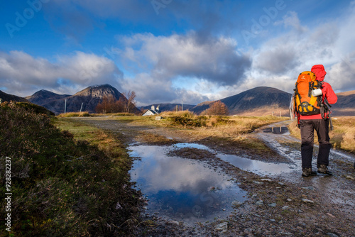 Hikers on a trek, Glen Coe Valley, Lochaber Geopark, Highlands, Scotland, United Kingdom photo