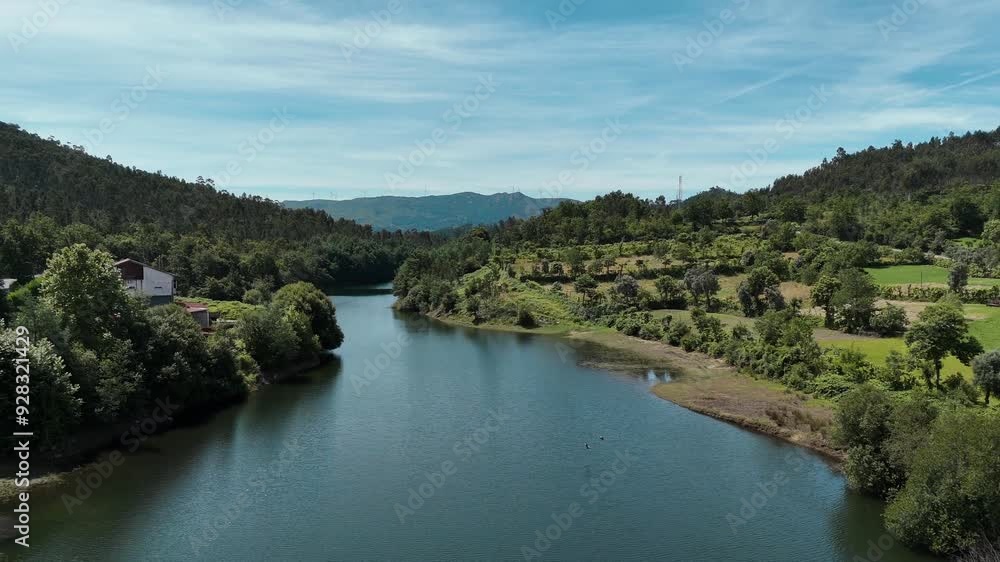 Storks crossing river in Vieira do Minho, Portugal Storks crossing river in Vieira do Minho, Portugal