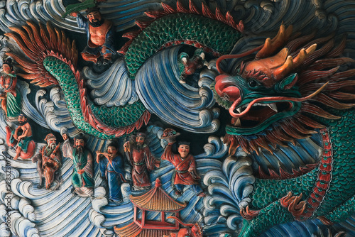 Wallpaper Mural Intricate dragon relief at an authentic temple in Singapore showcasing vibrant craftsmanship and cultural heritage Torontodigital.ca