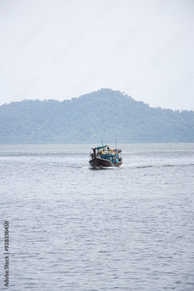 A boat, far away, in Thailand, handled by Burmese workers. A boat, far away, in Thailand, handled by Burmese workers.