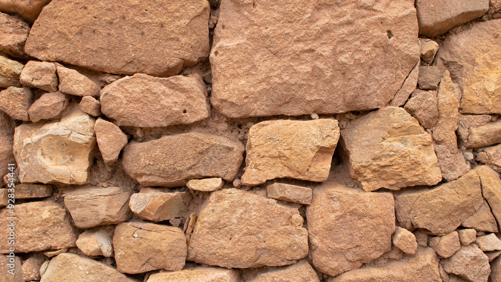 Old stone wall made without cement between the stones Old stone wall made without cement between the stones