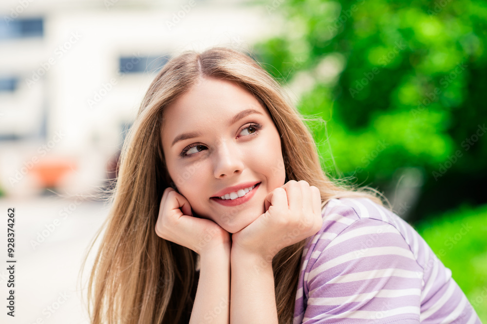 Photo of positive good mood girl dressed purple t-shirt smiling arms cheeks walking street outdoors uban city town Photo of positive good mood girl dressed purple t-shirt smiling arms cheeks walking street outdoors uban city town