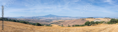 Val D'Orcia, Tuscany, Italy. Amazing landscape of the agricultural fields with gold and yellow colors. Earth's line. A perspective of the ground's colors and shapes photo