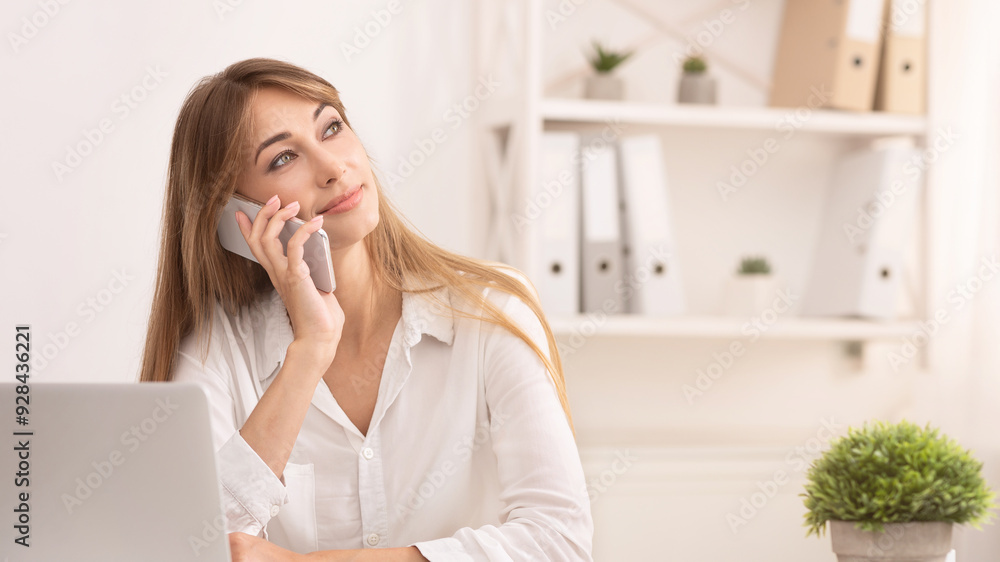 Office Lifestyle. Business Girl Talking On Phone Calling Client Sitting At Workplace Indoor Office Lifestyle. Business Girl Talking On Phone Calling Client Sitting At Workplace Indoor