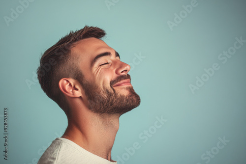 A close up of a man's face with his eyes closed