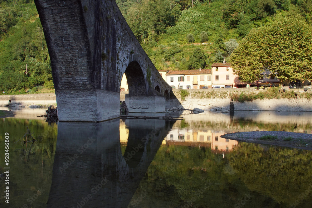 Fototapeta premium reflections with a bridge in a river