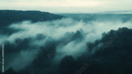 clouds or fog drifting through a forest or over a field in the early morning light, creating a mysterious and ethereal scener photo