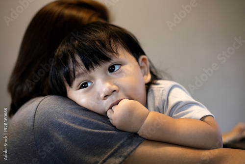 Little Boy Putting Fingers In His Mouth