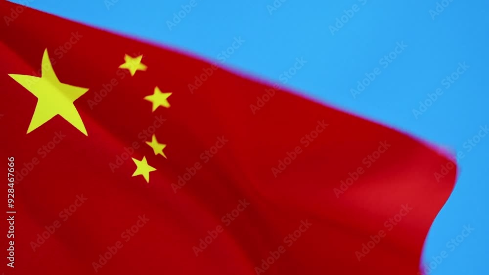 Slow motion video Chinese flag waving on blue sky background Slow motion video Chinese flag waving on blue sky background