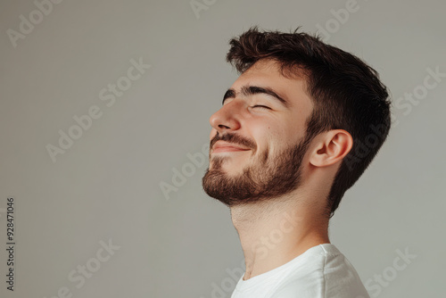 A close up of a man's face with his eyes closed