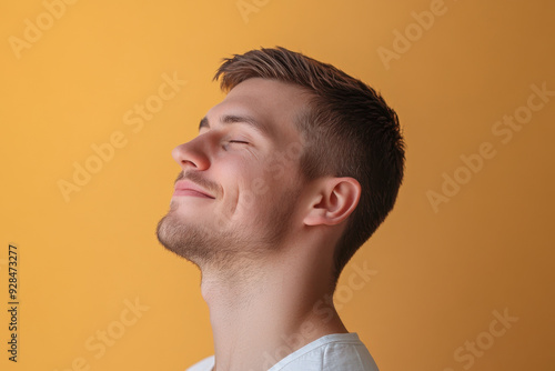 A close up of a man's face with his eyes closed