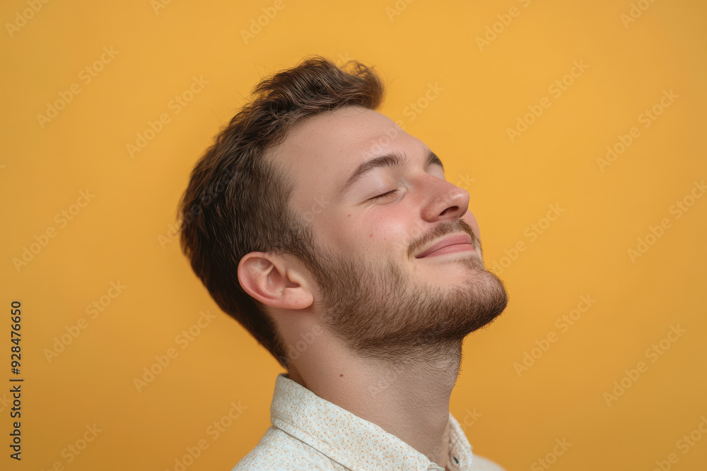 Obraz premium A close up of a man's face with his eyes closed