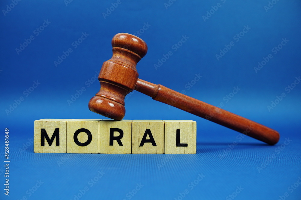 Moral alphabet letters with wooden blocks alphabet letters and Gavel on blue background Moral alphabet letters with wooden blocks alphabet letters and Gavel on blue background