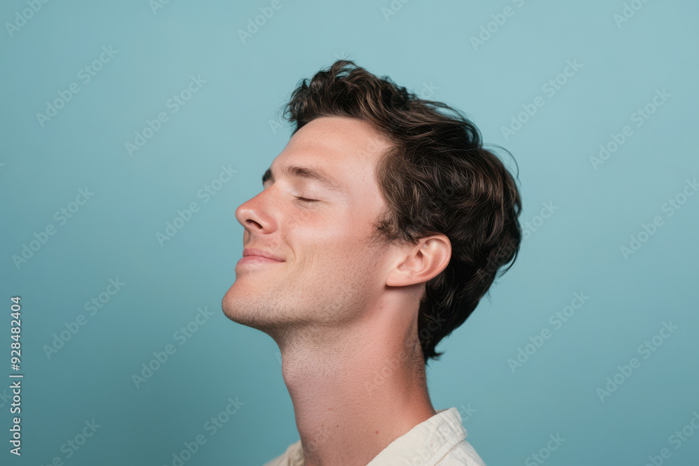 Fototapeta premium A close up of a man's face with his eyes closed