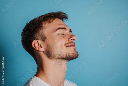 A close up of a man's face with his eyes closed