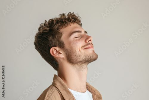 A close up of a man's face with his eyes closed