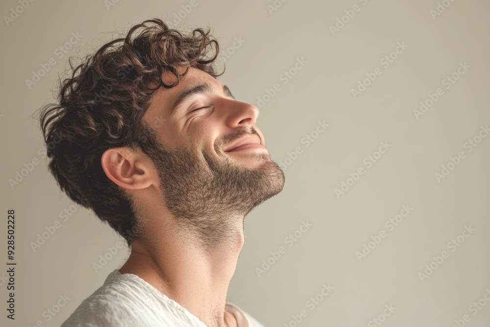 Fototapeta premium A close up of a man's face with his eyes closed