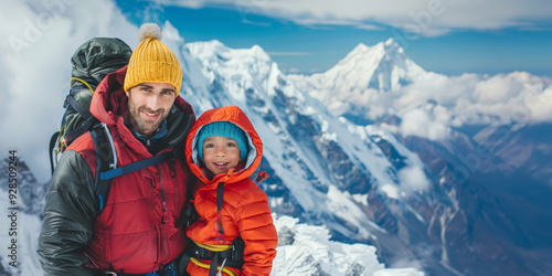 Father and child climbers in the highlands. Family of extreme travelers. Snowy mountain peak in background.
