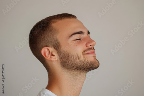 A close up of a man's face with his eyes closed