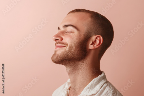 A close up of a man's face with his eyes closed