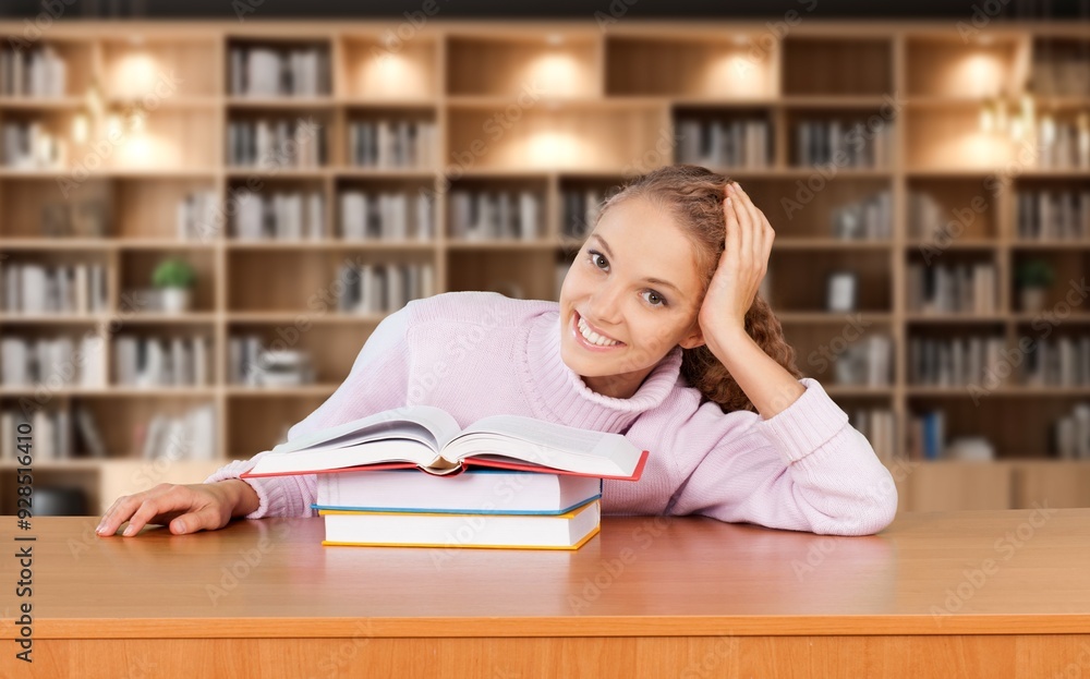 University student studying research in library University student studying research in library