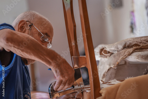 фотографія upholsterer craftsman working in the workshop