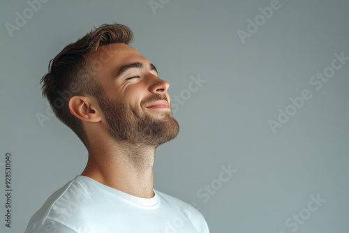 A close up of a man's face with his eyes closed