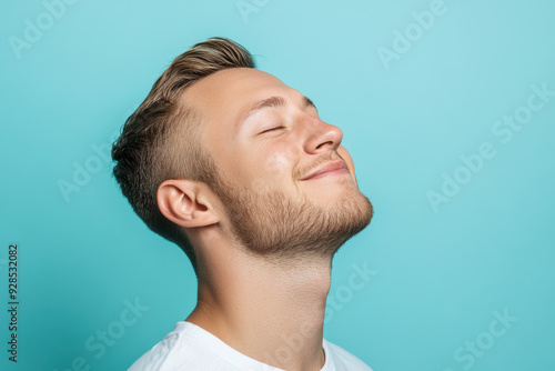 A close up of a man's face with his eyes closed