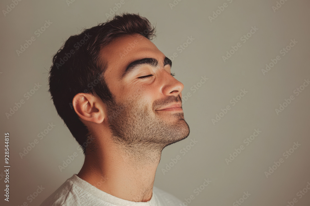 Obraz premium A close up of a man's face with his eyes closed