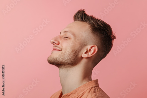 A close up of a man's face with his eyes closed