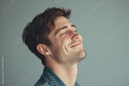 A close up of a man's face with his eyes closed